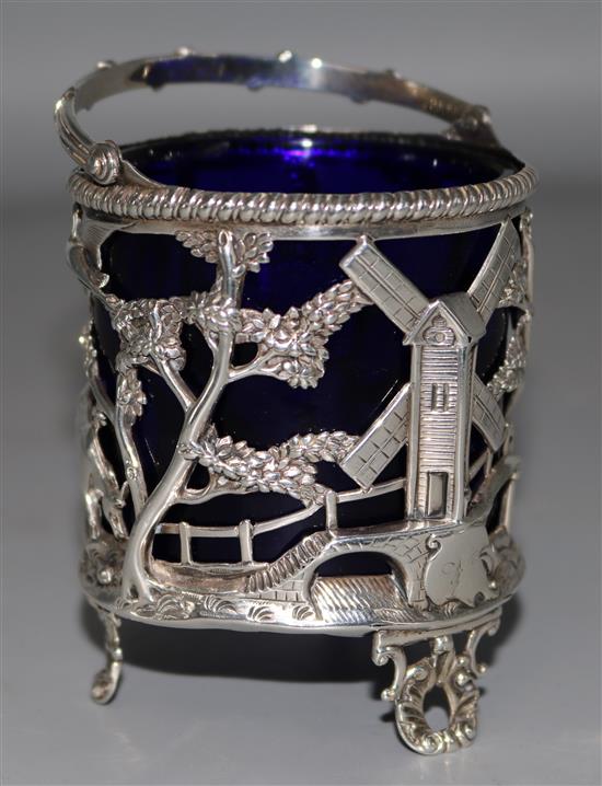 A George III silver sugar basket with blue glass liner, 3.5in.